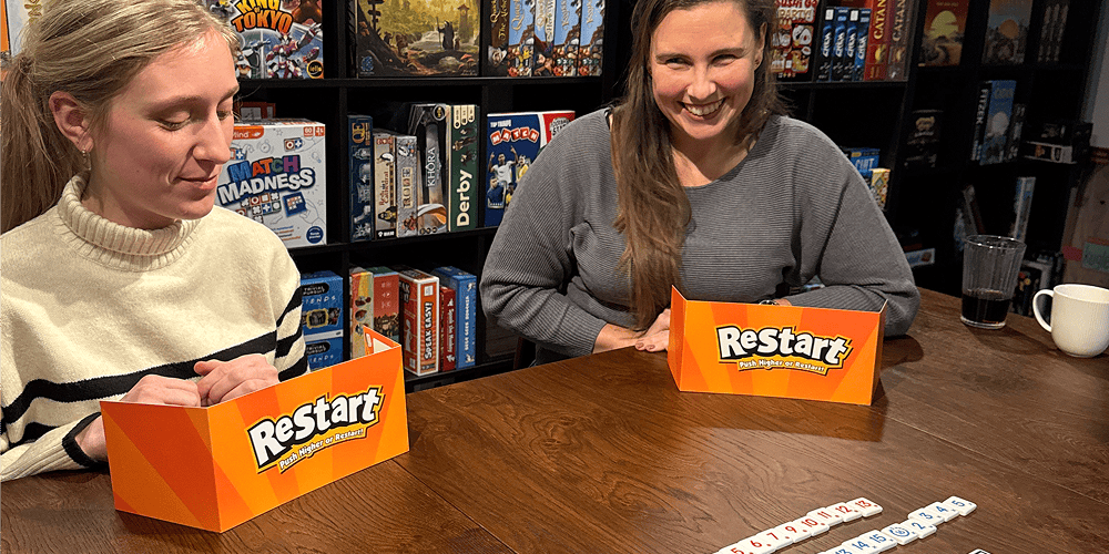 Personer der spiller Restart brætspil